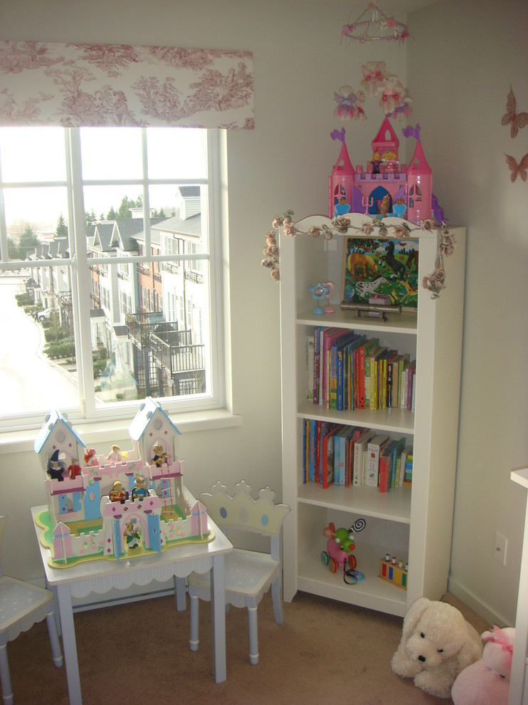 Photo of an eclectic kids' playroom for girls in Other with white walls and carpet.
