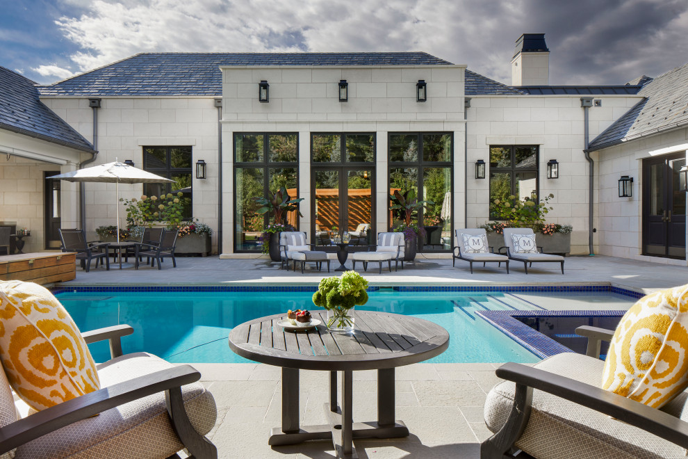 Example of a transitional backyard rectangular lap pool landscaping design in Denver