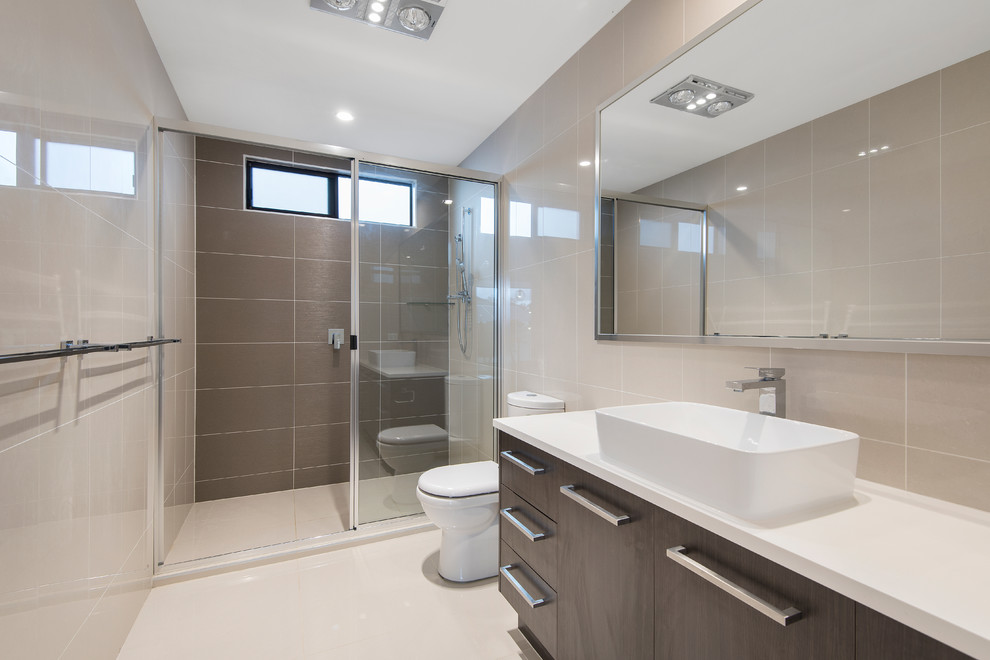 This is an example of a mid-sized contemporary 3/4 bathroom in Brisbane with open cabinets, dark wood cabinets, an open shower, brown tile, porcelain tile, brown walls, porcelain floors, a vessel sink and engineered quartz benchtops.