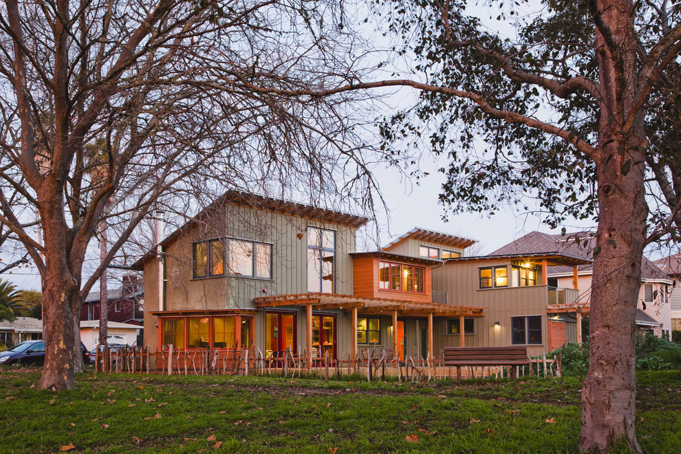Contemporary two-storey green exterior in San Francisco with concrete fiberboard siding and a shed roof.