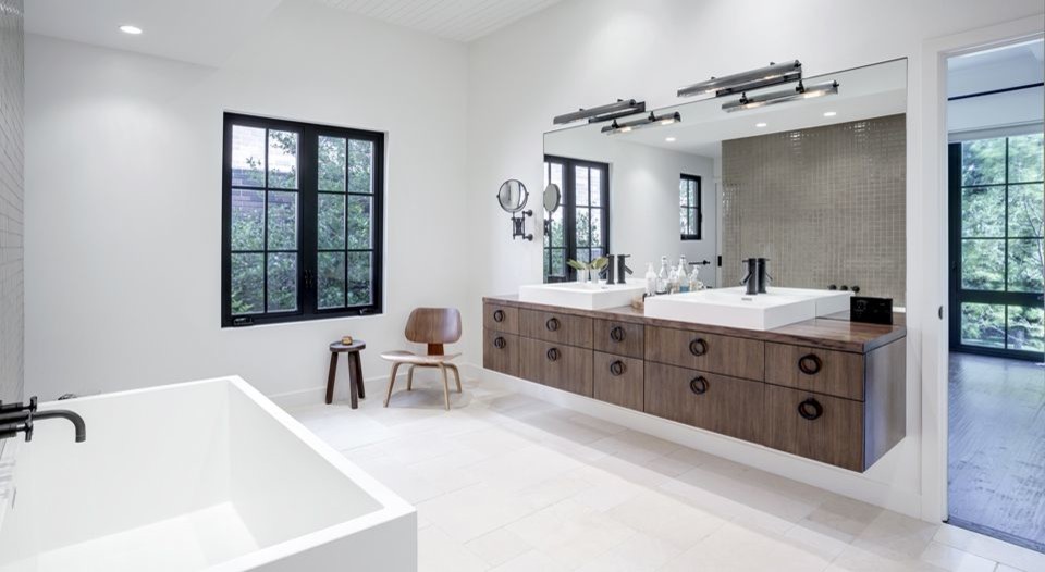 Photo of a large transitional master bathroom in Dallas with flat-panel cabinets, dark wood cabinets, a japanese tub, gray tile, ceramic tile, white walls, cement tiles, a vessel sink, wood benchtops, white floor and brown benchtops.