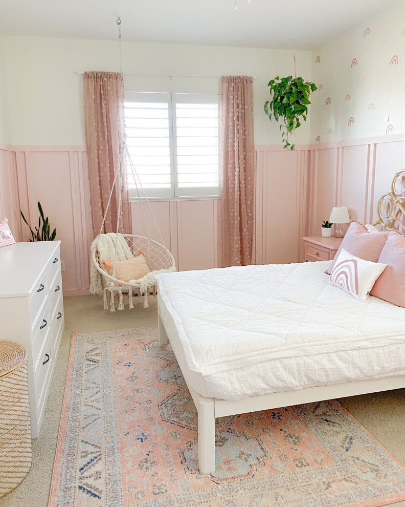 Design ideas for a country kids' bedroom for girls in Denver with pink walls and wainscoting.