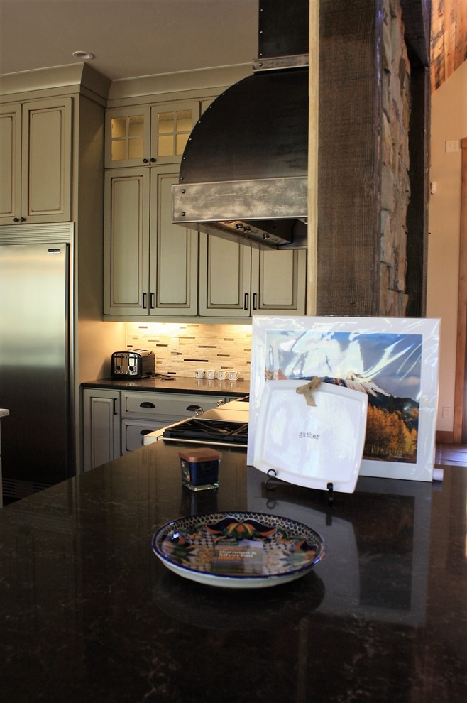 Open concept kitchen - huge rustic l-shaped open concept kitchen idea with an undermount sink, quartz countertops, beige backsplash, stone tile backsplash, stainless steel appliances and an island