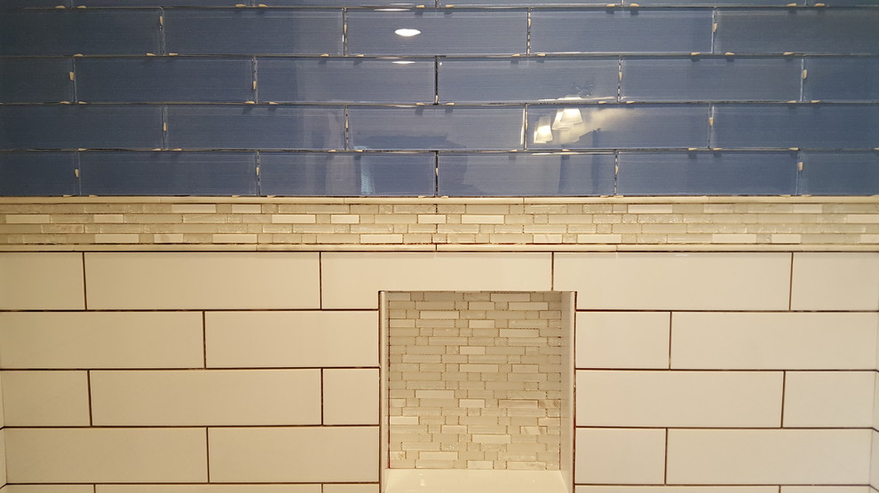 Small transitional 3/4 blue tile and glass tile porcelain tile alcove shower photo in Cincinnati with recessed-panel cabinets, black cabinets, a two-piece toilet, gray walls, an undermount sink and quartz countertops