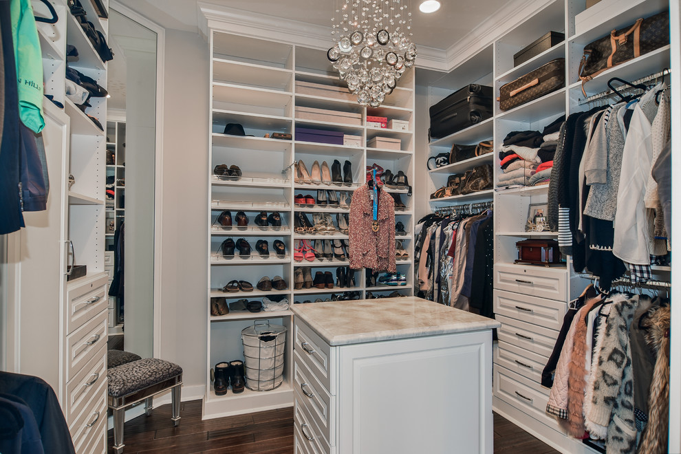 Inspiration for a large transitional women's walk-in wardrobe in Chicago with raised-panel cabinets, white cabinets and dark hardwood floors.
