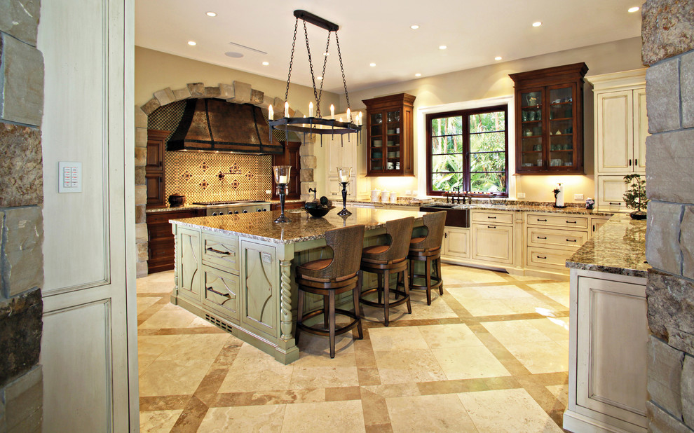Large country u-shaped separate kitchen in Miami with mosaic tile splashback, a farmhouse sink, beaded inset cabinets, white cabinets, granite benchtops, panelled appliances, travertine floors, with island and beige floor.