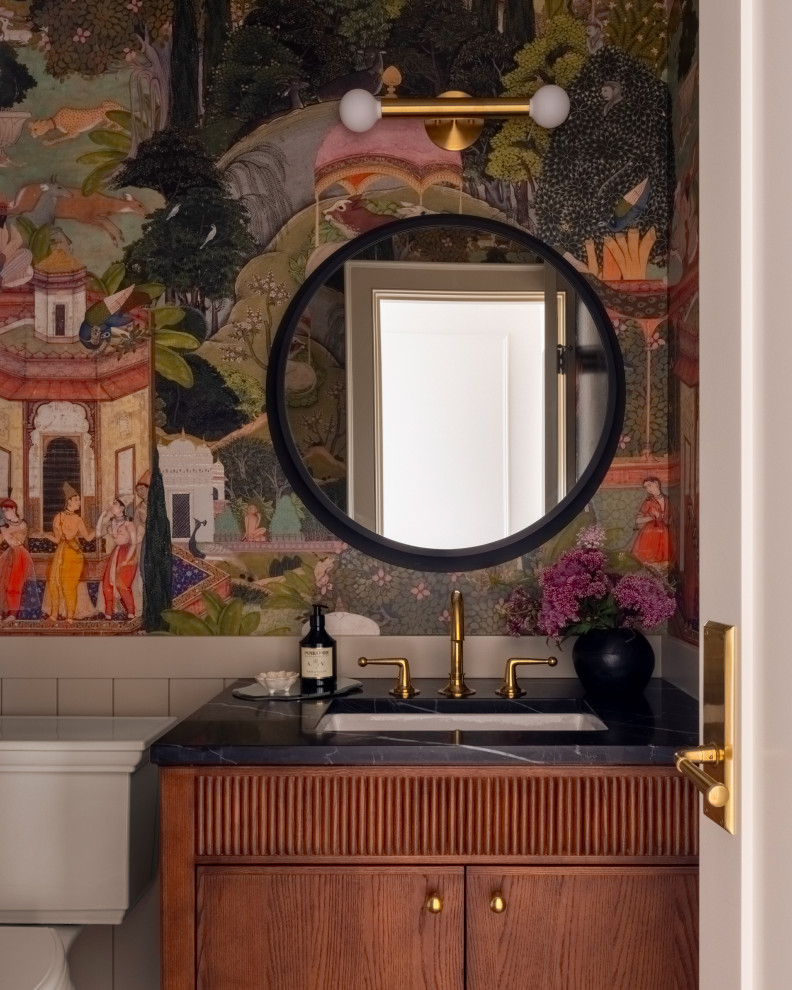 Example of a small classic wallpaper powder room design in Seattle with flat-panel cabinets, a two-piece toilet, multicolored walls, an undermount sink, quartzite countertops, black countertops, a freestanding vanity and medium tone wood cabinets