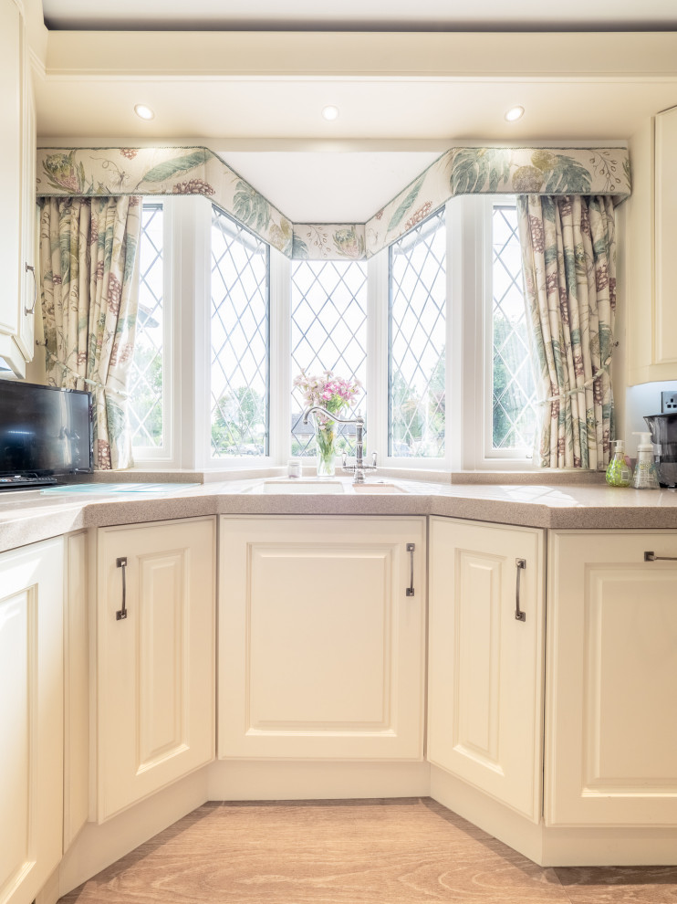 This is an example of a small traditional kitchen in West Midlands.