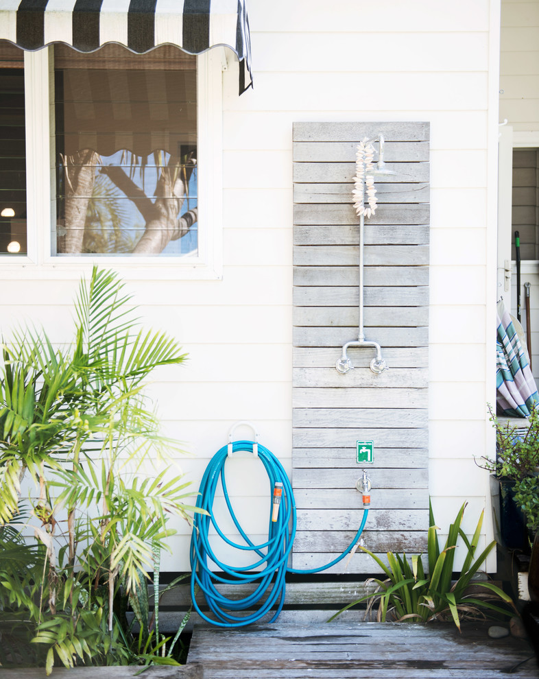 Design ideas for a small beach style one-storey white deck in Sydney with wood siding.