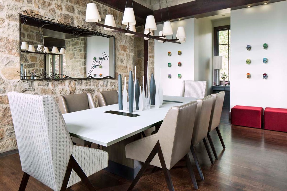 Contemporary dining room in Denver with white walls and dark hardwood floors.