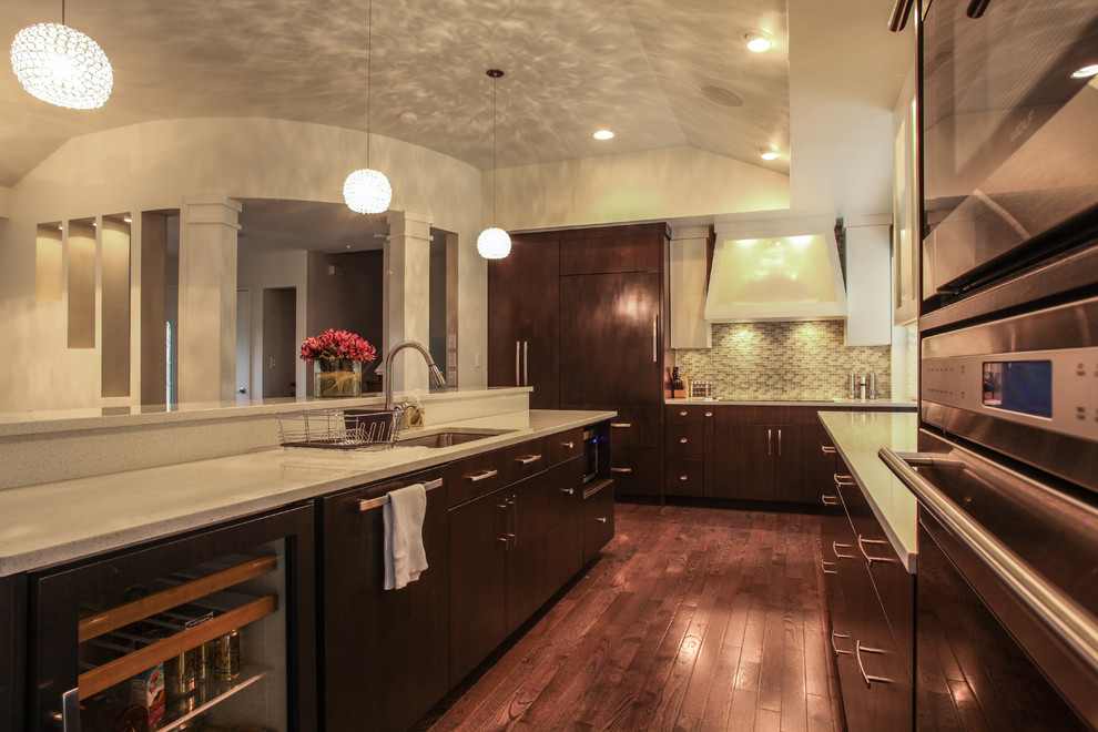 Inspiration for a large modern u-shaped dark wood floor eat-in kitchen remodel in Indianapolis with an undermount sink, flat-panel cabinets, dark wood cabinets, quartz countertops, brown backsplash, glass tile backsplash, stainless steel appliances and an island