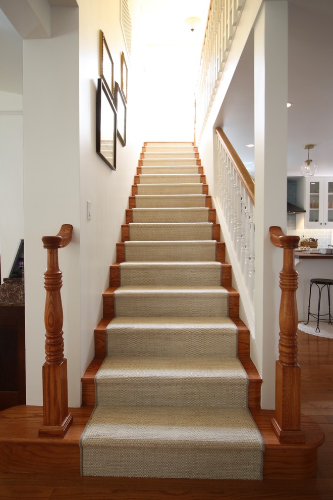 Inspiration for a mid-sized contemporary wood straight staircase in Los Angeles with wood risers and wood railing.