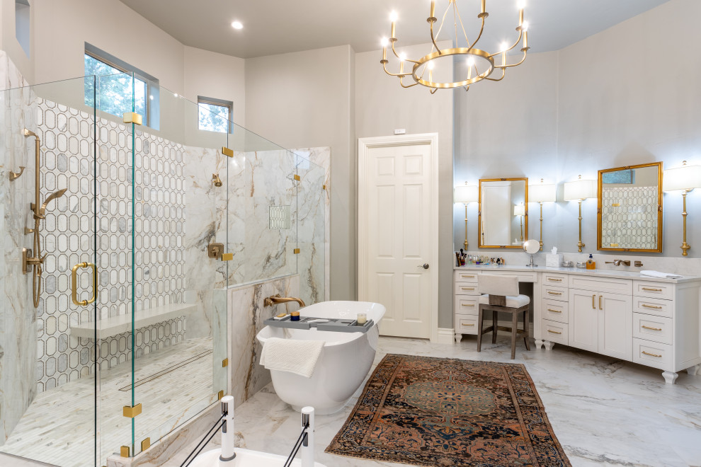 Inspiration for an expansive traditional master bathroom in Austin with furniture-like cabinets, white cabinets, a freestanding tub, a double shower, a one-piece toilet, white tile, porcelain tile, grey walls, porcelain floors, an undermount sink, engineered quartz benchtops, white floor, a hinged shower door, white benchtops, a shower seat, a double vanity, a freestanding vanity and vaulted.