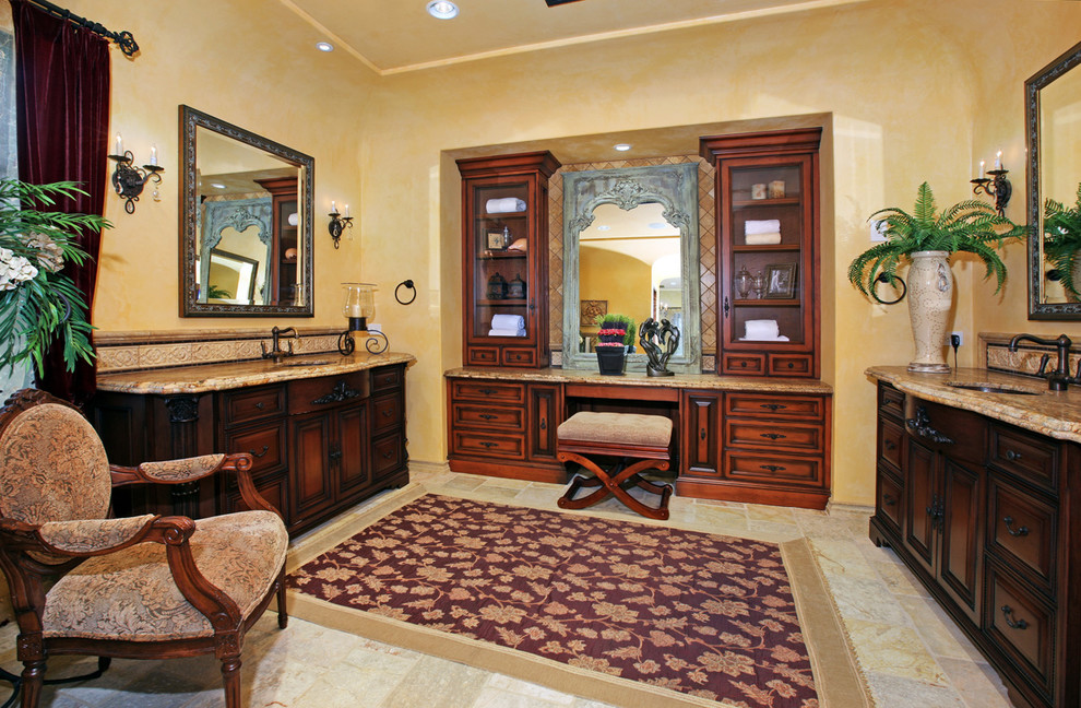 Mid-sized mediterranean bathroom in Orange County with an undermount sink, furniture-like cabinets, medium wood cabinets, granite benchtops, a freestanding tub, an alcove shower and yellow walls.