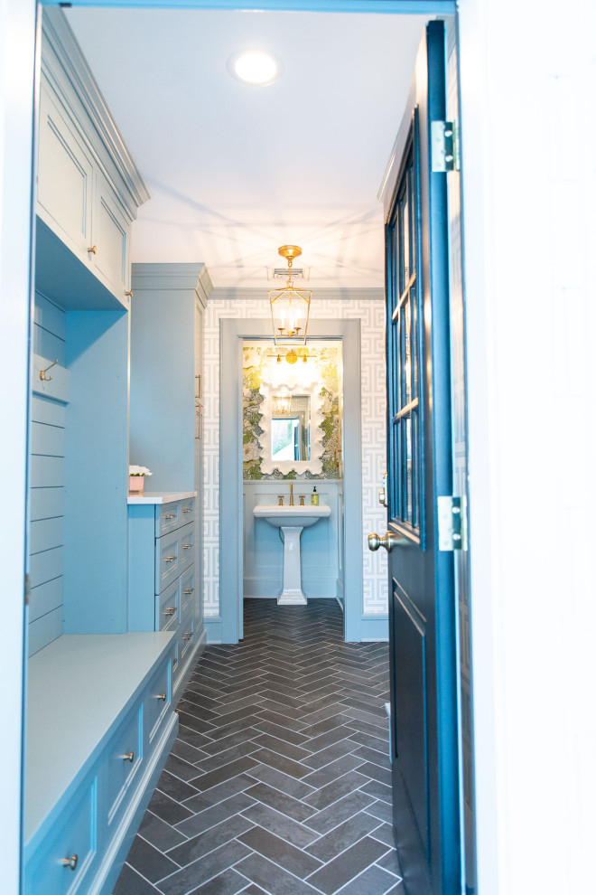 Example of a mid-sized transitional ceramic tile, gray floor and wallpaper entryway design in New York with blue walls and a blue front door