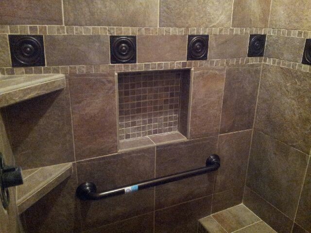 Inspiration for a transitional brown tile bathroom remodel