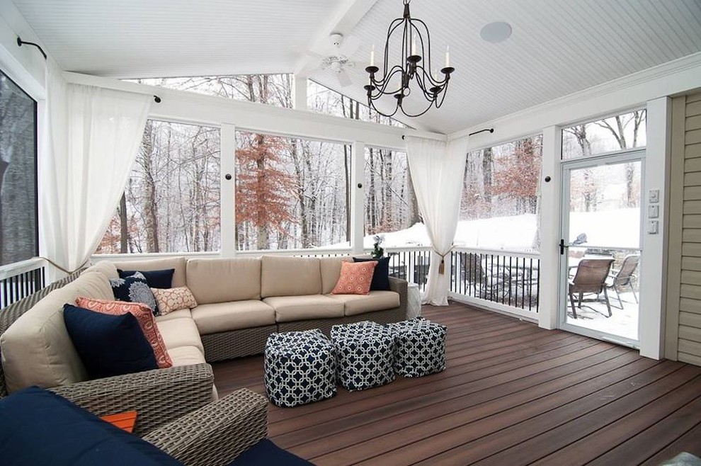 Example of a transitional backyard balcony deck design in Baltimore with a roof extension