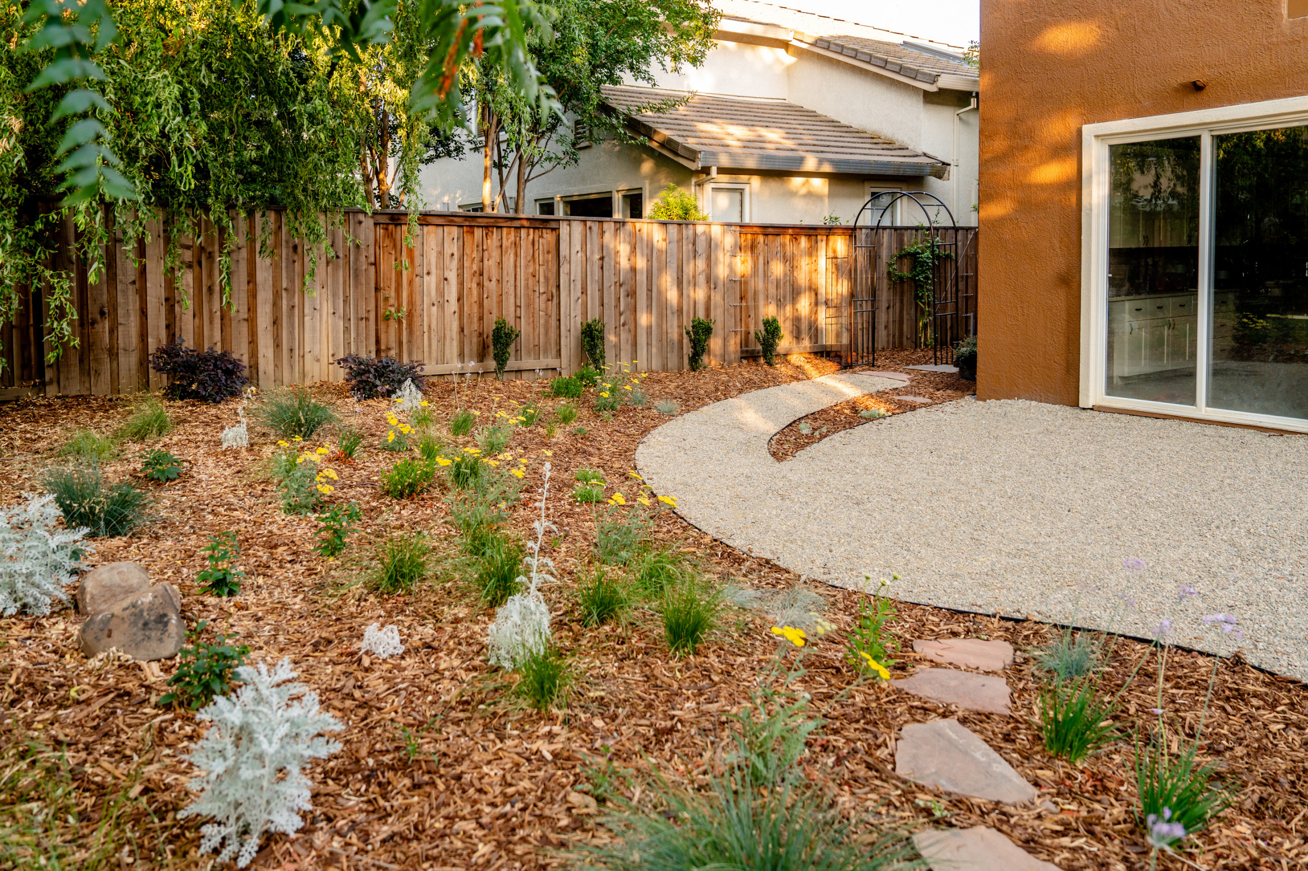 Gravel Patio, Curved Arbor, and Emerging Meadow