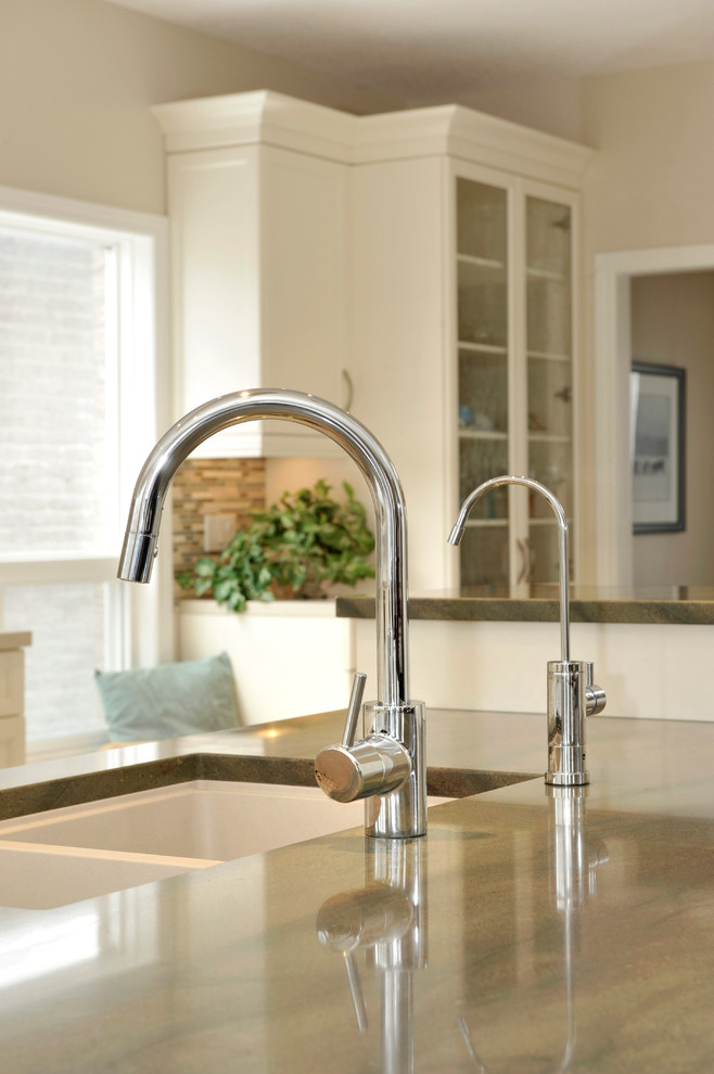 Inspiration for a large transitional porcelain tile kitchen remodel in Toronto with a double-bowl sink, shaker cabinets, white cabinets, granite countertops, multicolored backsplash, matchstick tile backsplash, stainless steel appliances and an island