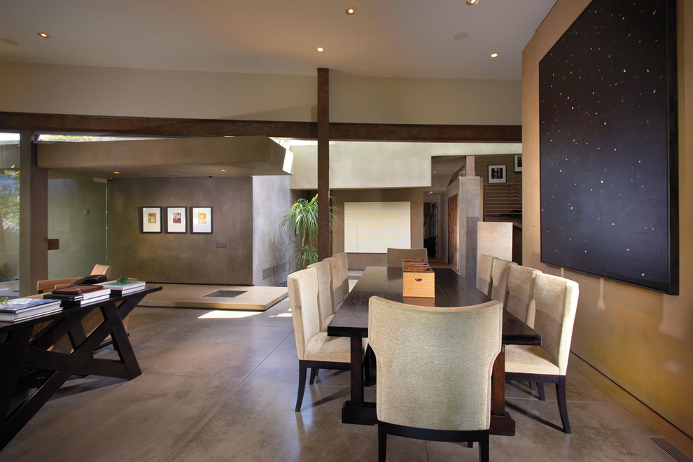 This is an example of a contemporary dining room in Orange County with beige walls.