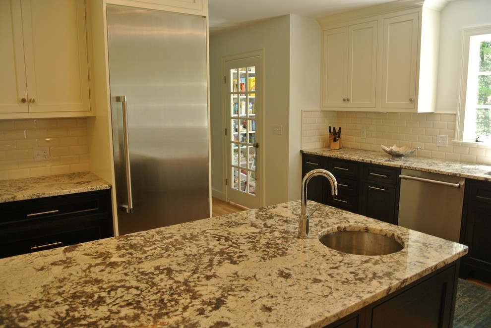 Transitional light wood floor eat-in kitchen photo in Boston with an undermount sink, shaker cabinets, granite countertops, white backsplash, subway tile backsplash, stainless steel appliances and an island