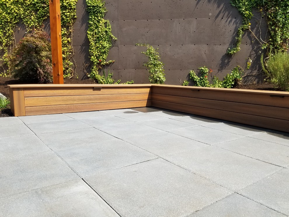 Inspiration for a small backyard concrete paver landscaping in Seattle.