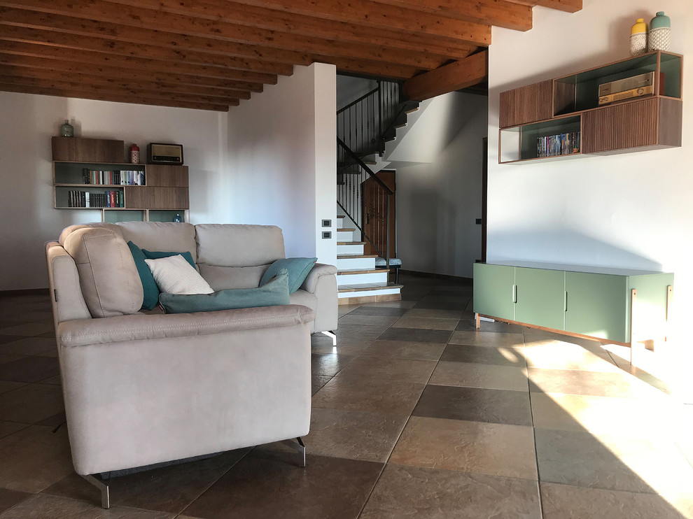 This is an example of a large midcentury open plan dining in Other with beige walls, porcelain floors, no fireplace and multi-coloured floor.