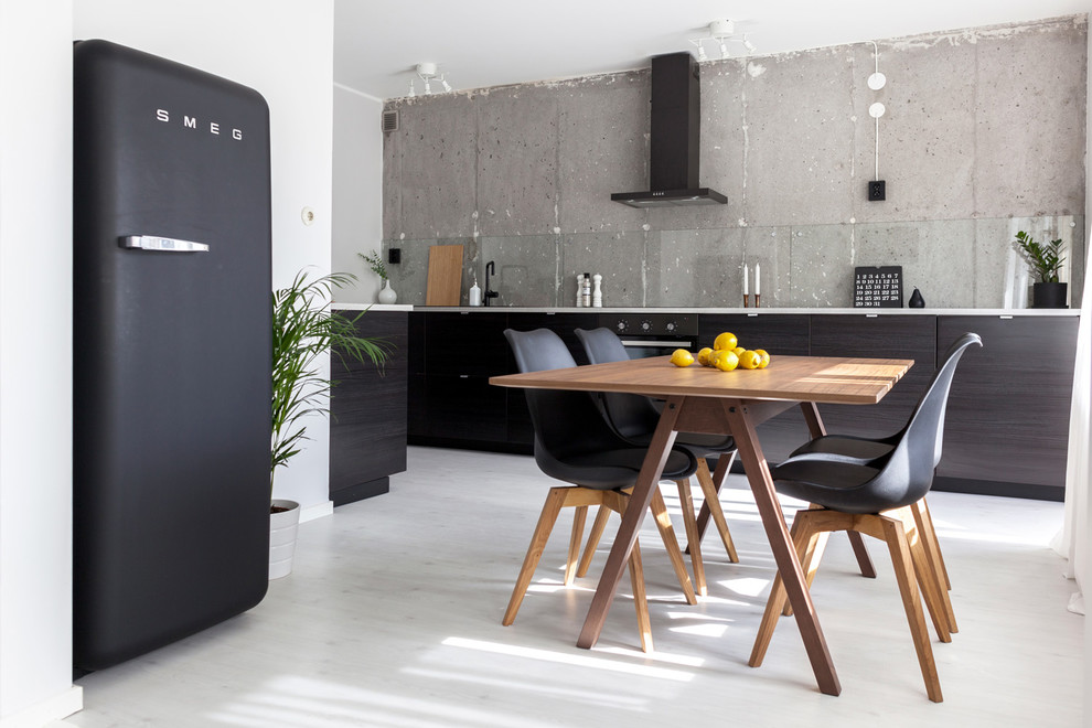 Design ideas for a scandinavian single-wall eat-in kitchen in Other with flat-panel cabinets, dark wood cabinets, black appliances, glass sheet splashback, painted wood floors and no island.