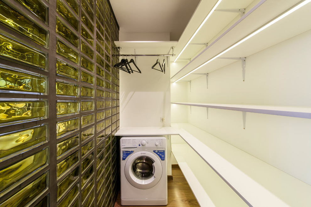 Design ideas for a small contemporary laundry room in Moscow.