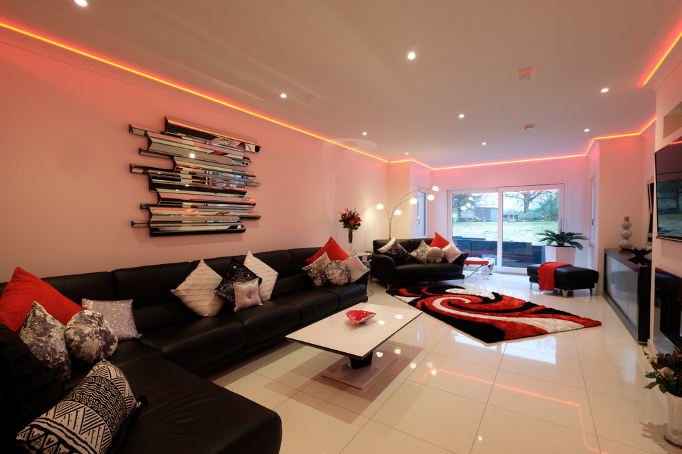 This is an example of a large modern formal living room in Hertfordshire with white walls, porcelain floors, a built-in media wall and white floor.