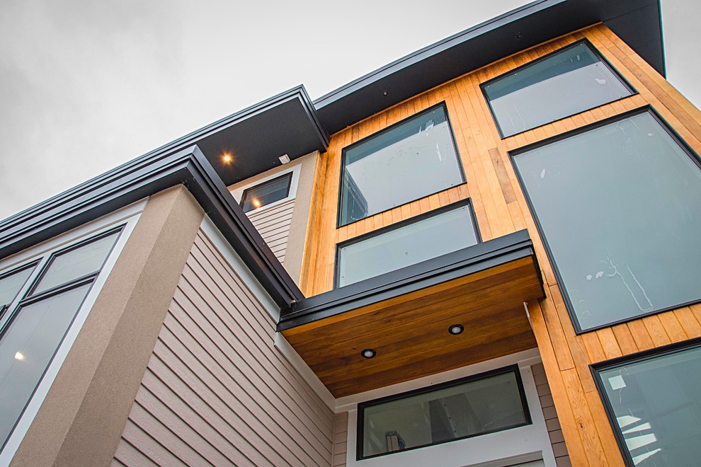 Example of a minimalist exterior home design in Boston