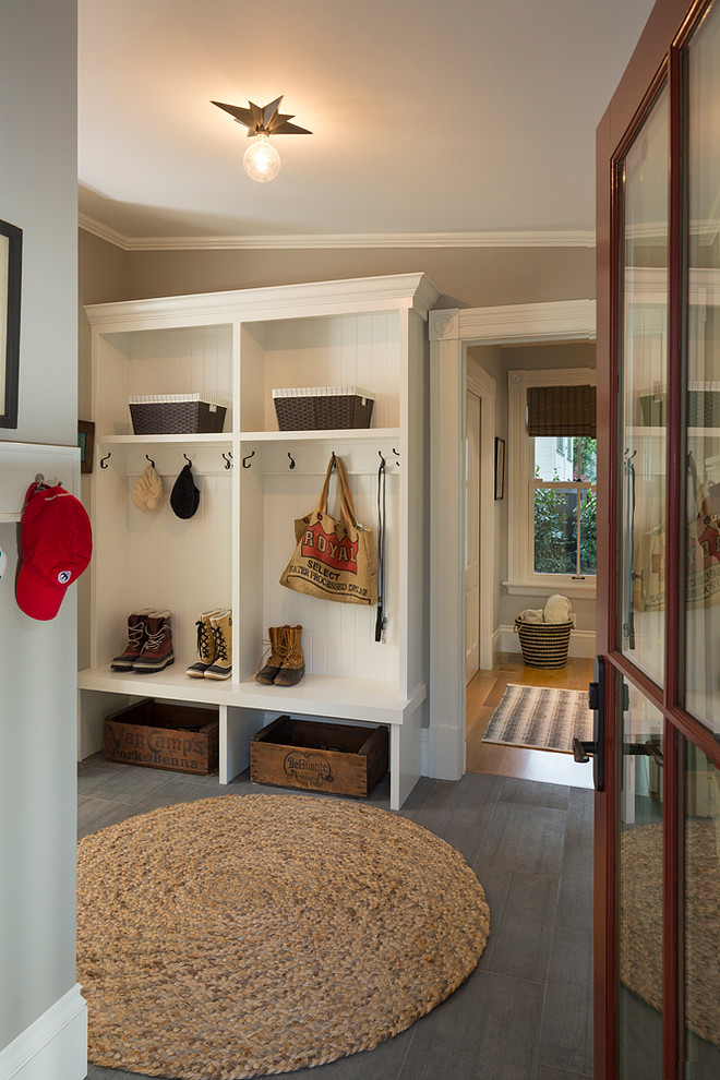 Inspiration for a country mudroom in San Francisco with beige walls and dark hardwood floors.