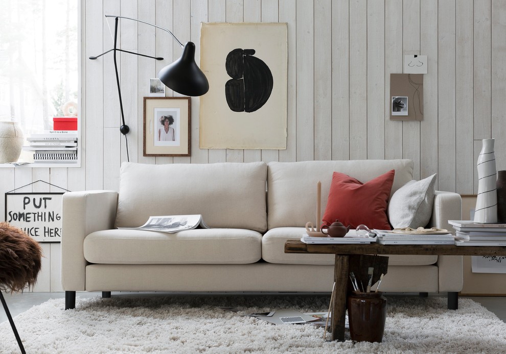 Photo of a mid-sized scandinavian living room in Other with white walls, carpet and white floor.