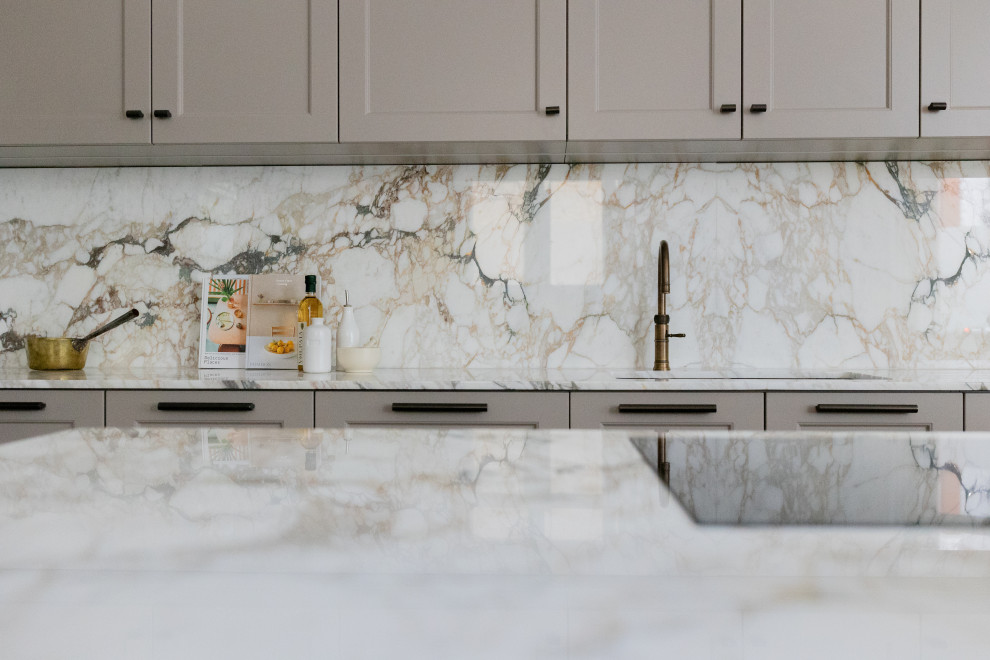 Design ideas for a transitional kitchen in London with marble floors.
