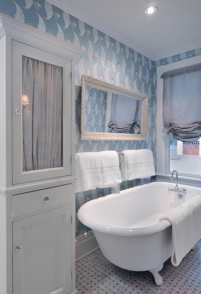 Inspiration for a mid-sized traditional kids bathroom in New York with a claw-foot tub, blue walls, a pedestal sink, gray tile, mosaic tile and marble floors.