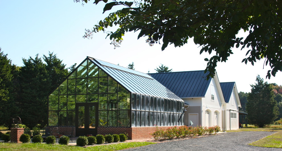 Inspiration for an expansive traditional detached greenhouse in Other.