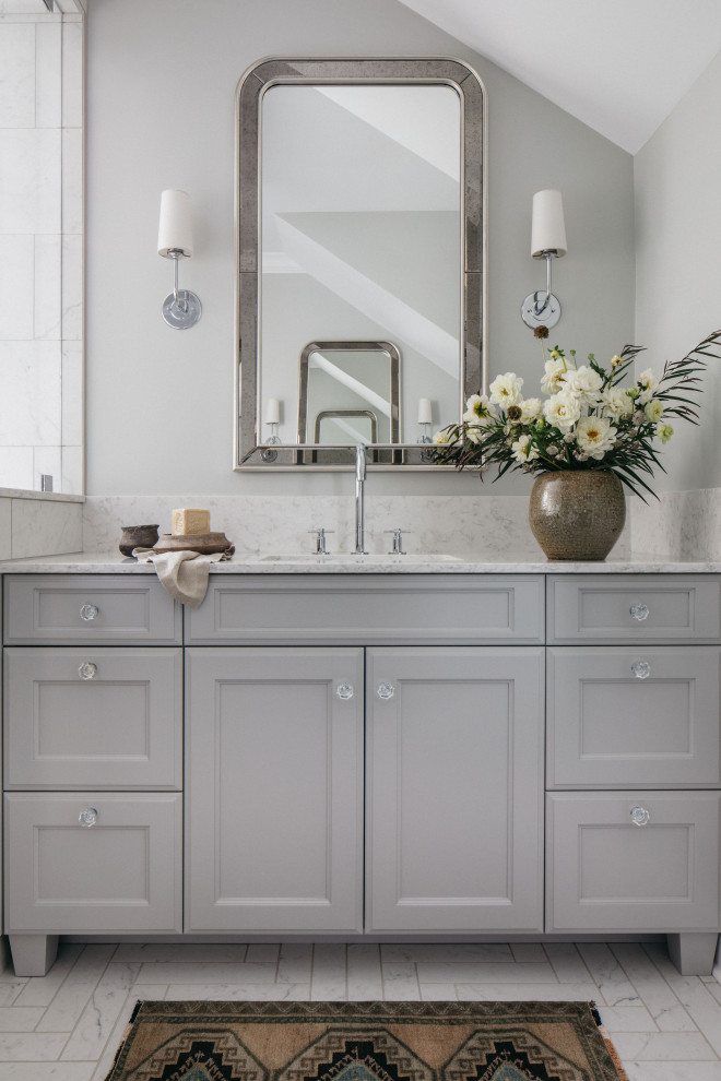 This is an example of a large eclectic master bathroom in Chicago with recessed-panel cabinets, grey cabinets, marble benchtops, white benchtops, a single vanity, a built-in vanity, white tile, marble, a one-piece toilet, grey walls, mosaic tile floors, a drop-in sink, white floor, a hinged shower door, a shower seat and a double shower.