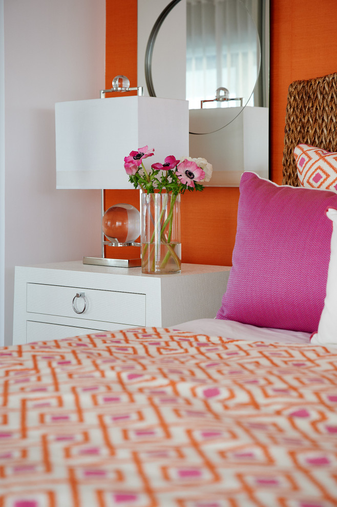 Small transitional guest bedroom in Other with orange walls, porcelain floors, no fireplace and grey floor.