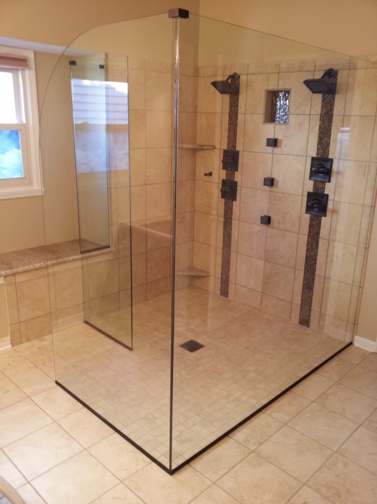 Large traditional master bathroom in Indianapolis with an open shower, beige tile, stone tile, beige walls, ceramic floors, granite benchtops, beige floor and an open shower.