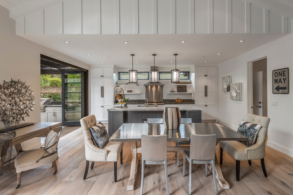 Kitchen/dining room combo - mid-sized farmhouse light wood floor and beige floor kitchen/dining room combo idea in San Francisco with white walls and no fireplace