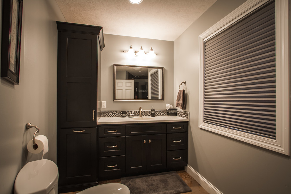Inspiration for a transitional 3/4 bathroom remodel with shaker cabinets and black cabinets