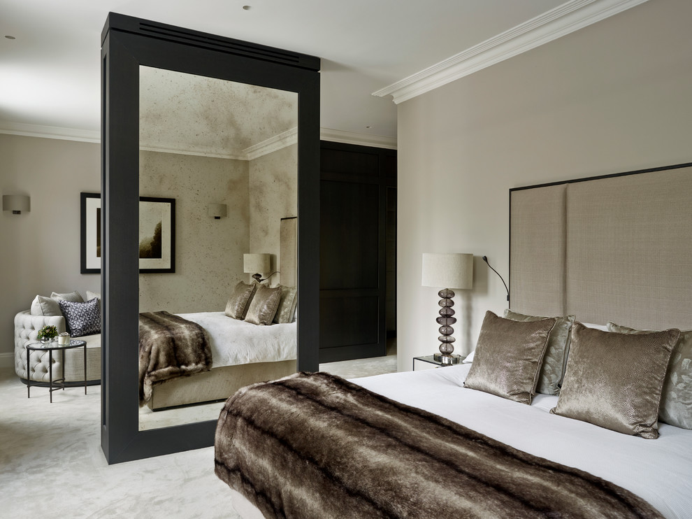 This is an example of a mid-sized contemporary master bedroom in London with grey walls, carpet and no fireplace.