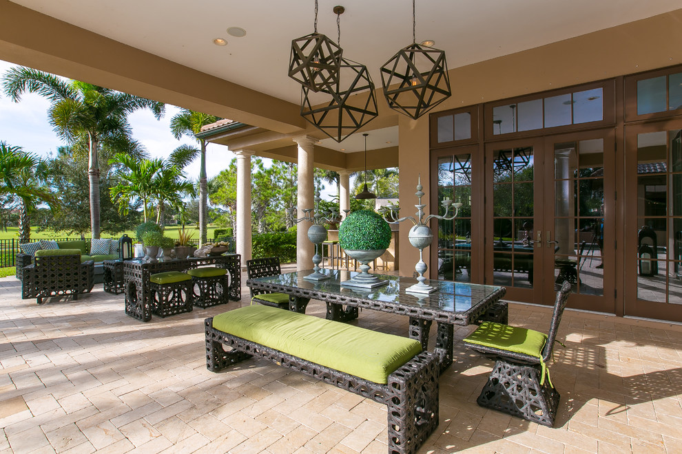 Inspiration for a transitional patio in Tampa with a roof extension.
