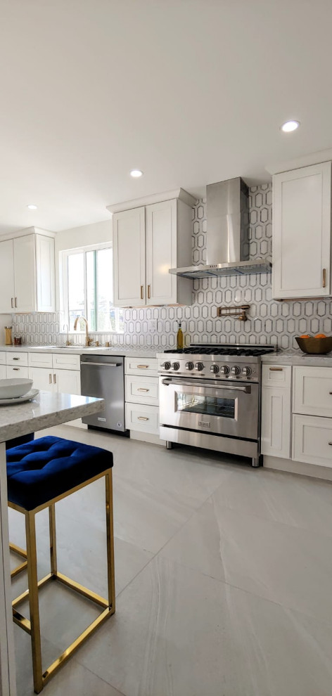 Design ideas for a mid-sized modern galley separate kitchen in Los Angeles with shaker cabinets, white cabinets, quartz benchtops, multi-coloured splashback, marble splashback, stainless steel appliances, porcelain floors, no island, grey benchtop, an undermount sink and grey floor.