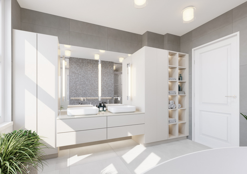 This is an example of a large contemporary grey and white shower room bathroom in Berlin with white cabinets, a built-in bath, a corner shower, a wall mounted toilet, grey tiles, grey walls, porcelain flooring, a built-in sink, marble worktops, white floors, an open shower, white worktops, double sinks and a built in vanity unit.