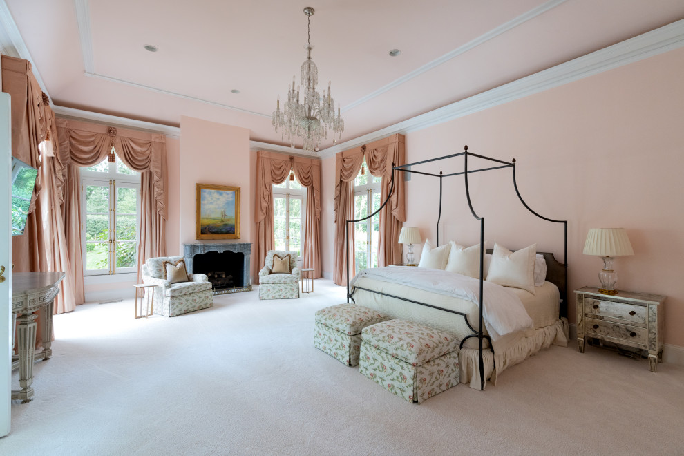 Inspiration for an expansive traditional master bedroom in Atlanta with pink walls, carpet, a standard fireplace, a stone fireplace surround and white floor.