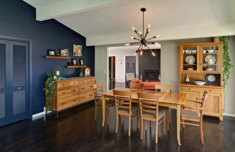 Expansive transitional dining room in Minneapolis with blue walls, dark hardwood floors and no fireplace.