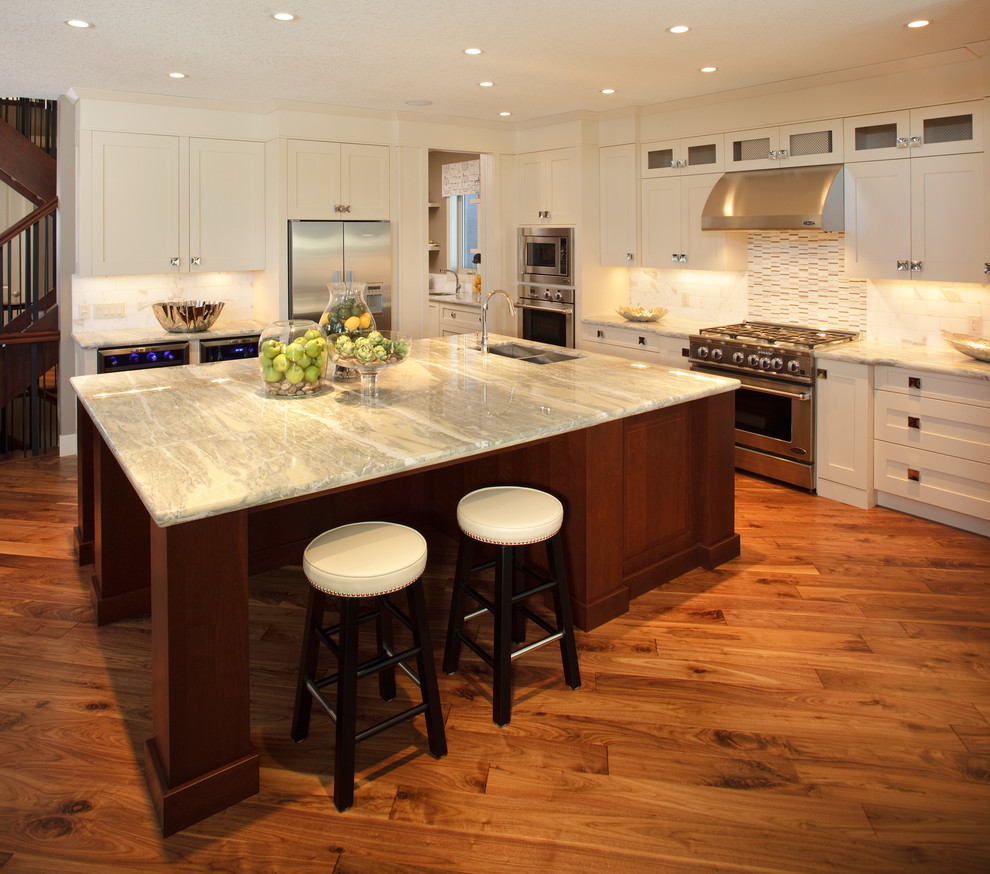 Example of a small transitional l-shaped ceramic tile eat-in kitchen design in Phoenix with a double-bowl sink, recessed-panel cabinets, white cabinets, marble countertops, multicolored backsplash, mosaic tile backsplash and an island
