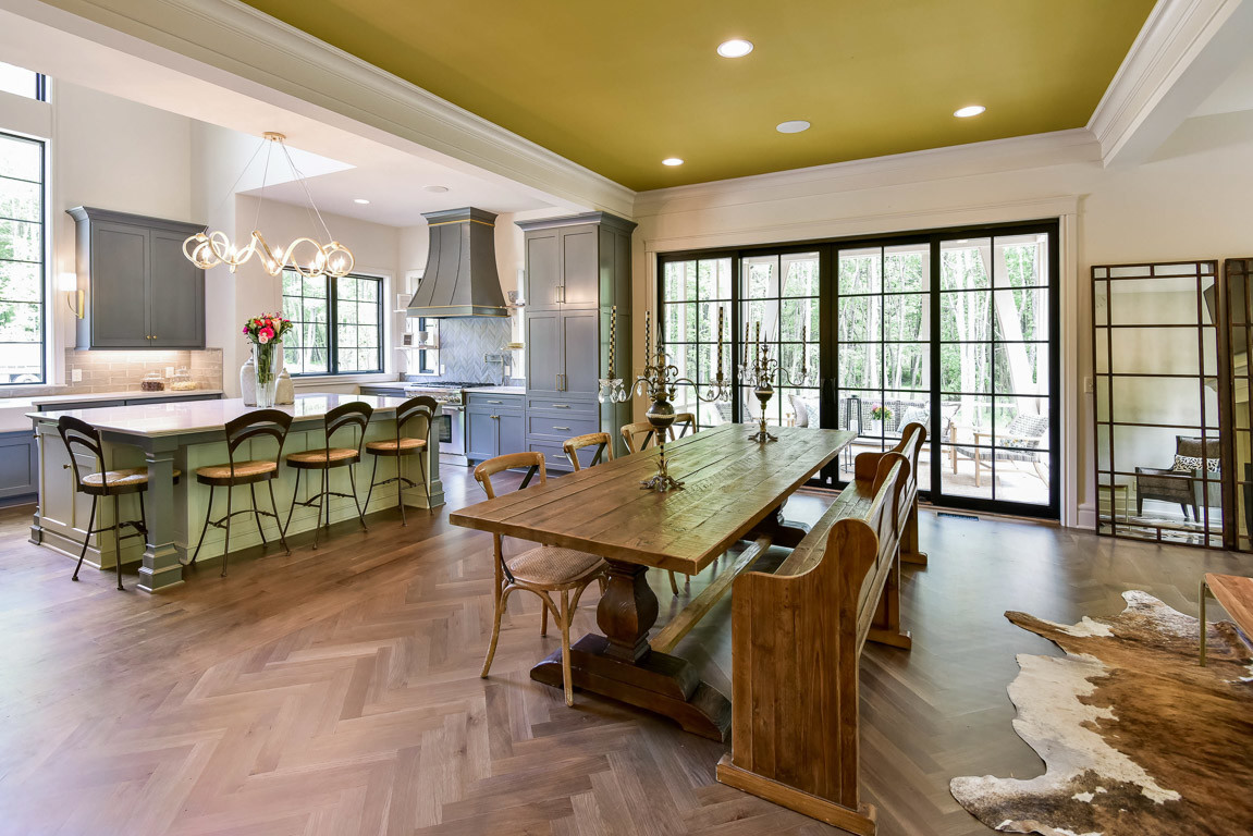 Farmhouse dark wood floor and brown floor great room photo in Cleveland with white walls