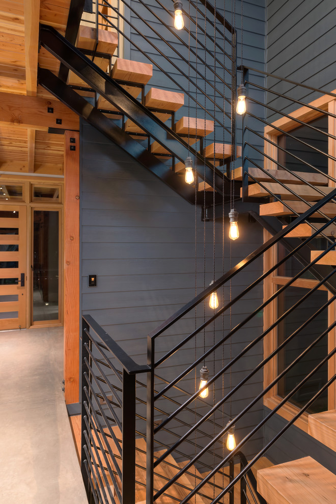 This is an example of a large country wood floating staircase in San Francisco with open risers.